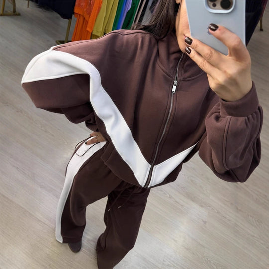 Damen eleganter sportlicher Zweiteiler Trainingsanzug mit Reißverschluss und kontrastierender V-Passe Shop Nory