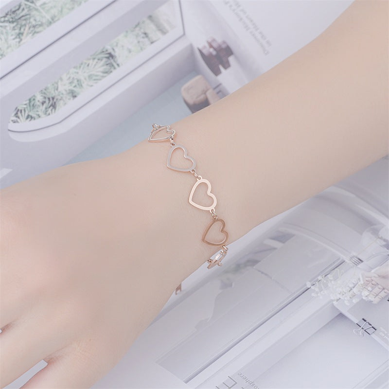 Damen Herzarmband mit eleganten, filigranen Anhängern Shop Nory