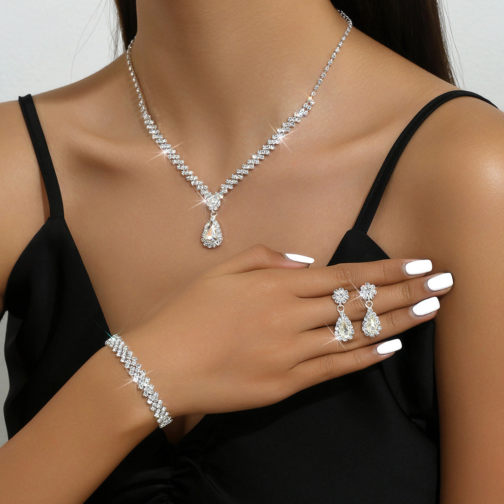 Tropfenpendant und passendes Tropfohrschmuckset für Braut mit kubischem Zirkonia-Halo