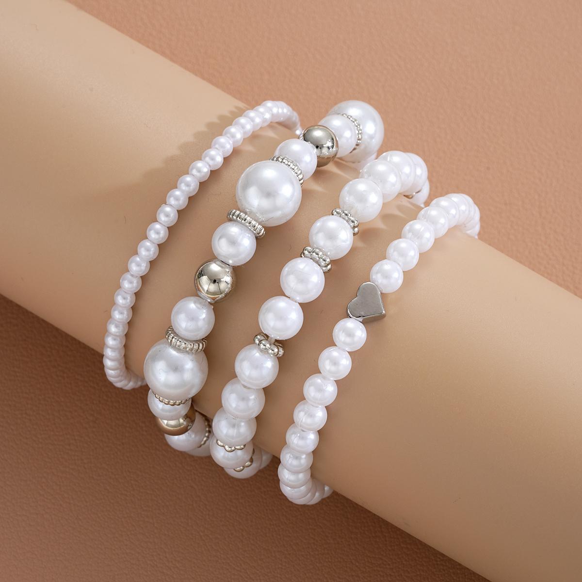 Damen Schmuckarmband-Set mit eleganten Perlen und silbernen Akzenten Shop Nory