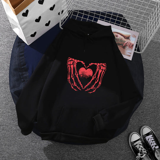 Damen nan stylischer Kapuzenpullover mit Skeletthand Herzmotiv und Kängurutasche Shop Nory