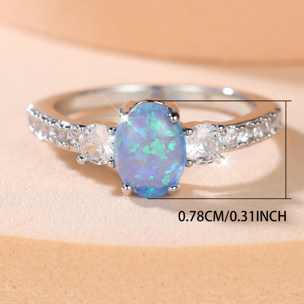 Damen Ring mit funkelndem Opal und zarten Zirkonia-Details Shop Nory