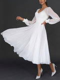 ShopNory Damen Midikleid mit Wickeloptik und transparenten Ärmeln