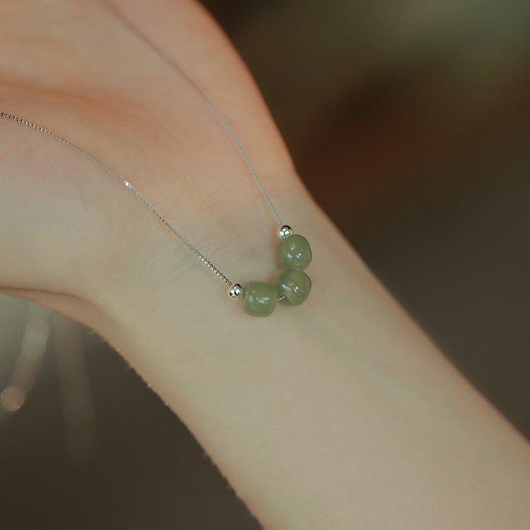 Damen Halskette mit hochwertigem Jade-Anhänger und Edelstahl-Elementen Shop Nory