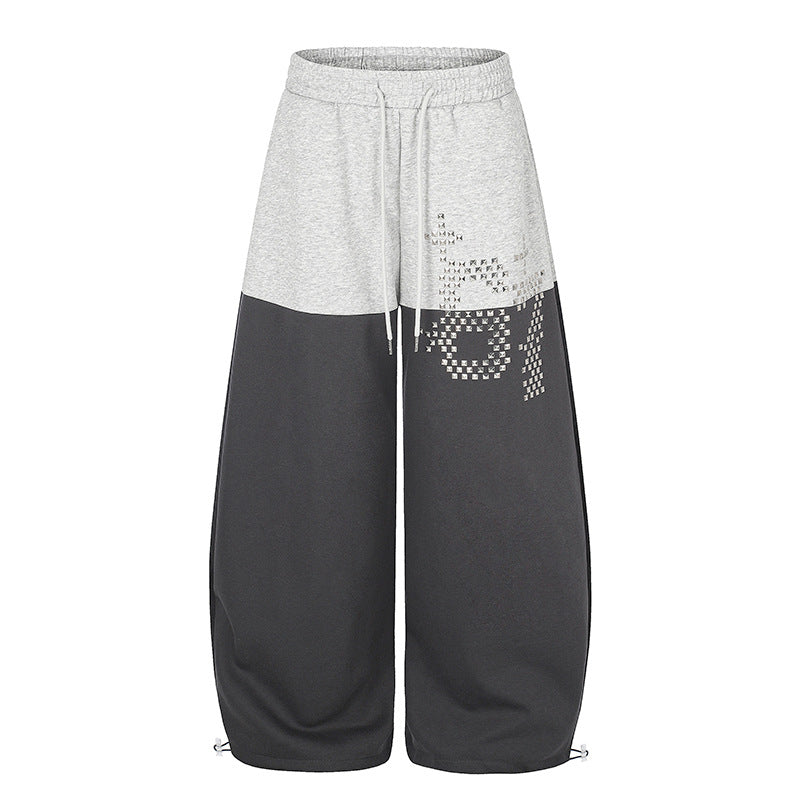 Damen Oversize Two‑Tone Palazzo‑Sweathose aus French Terry mit Logo‑Nieten, Tunnelzug und verstellbarem Saum Shop Nory