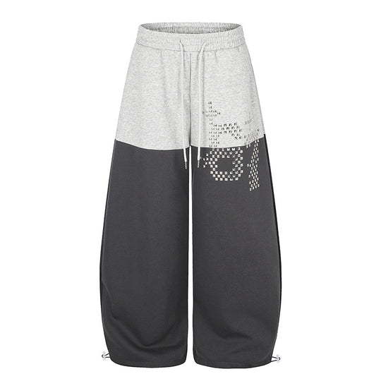 Damen Oversize Two‑Tone Palazzo‑Sweathose aus French Terry mit Logo‑Nieten, Tunnelzug und verstellbarem Saum Shop Nory