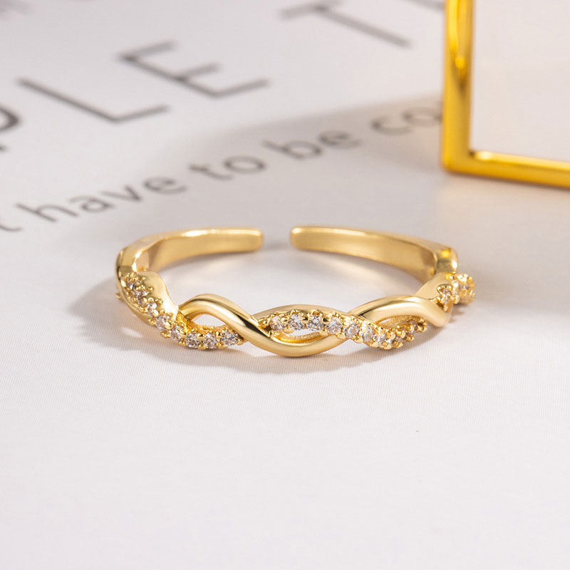 Damenring im eleganten Knoten-Design mit funkelnden Zirkonia-Steinen Shop Nory
