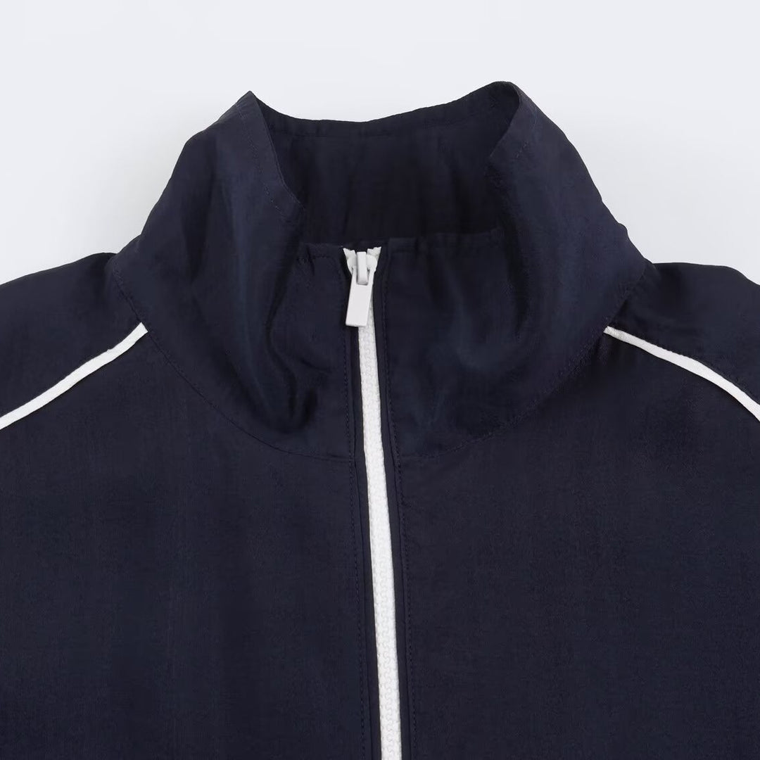 Damen Cropped Windbreaker-Jacke mit hohem Funnelkragen, Kontrastpaspel und elastischem Saum Shop Nory