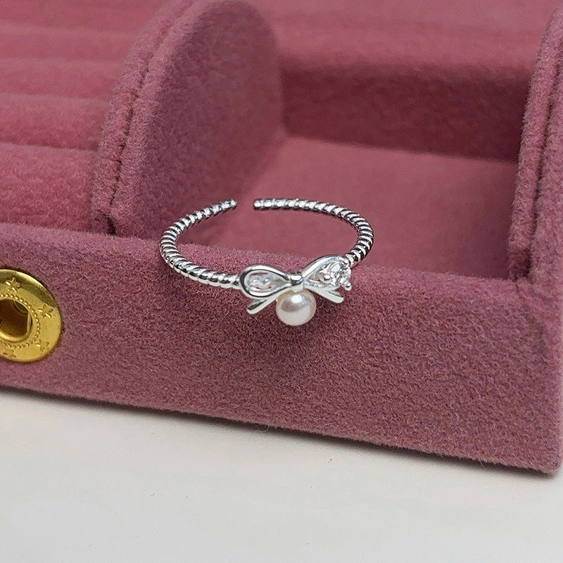 Damen Ring mit elegantem Schleifen- und Perlenmotiv Shop Nory