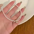 Damen Perlenarmband mit luxuriösem Herzanhänger Shop Nory
