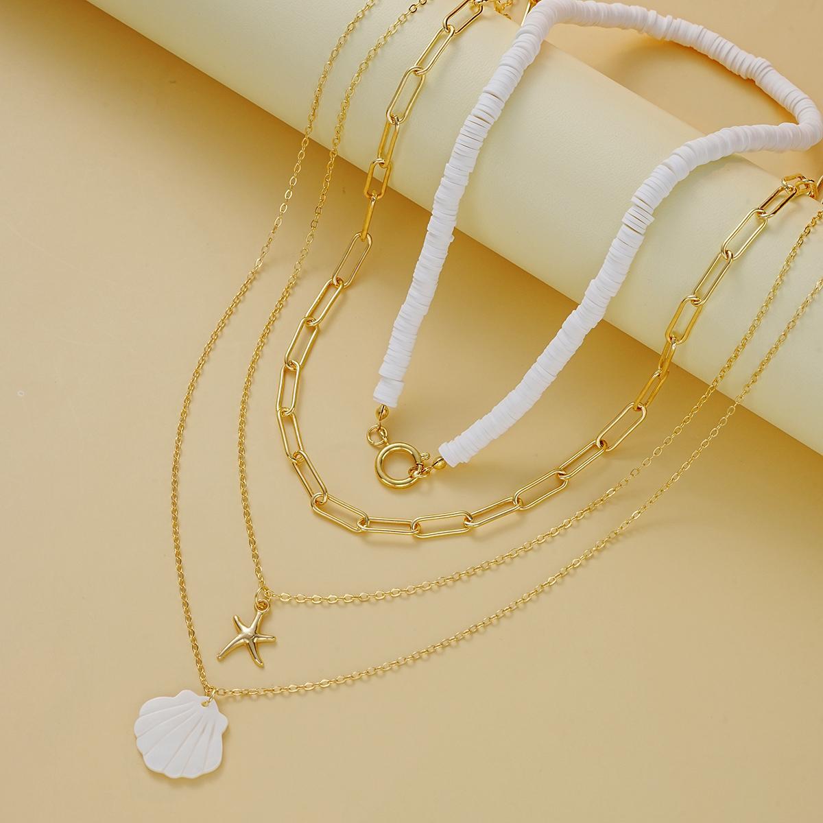 Damen mehrschichtige Halskette mit stilvollen Muschel-Anhängern und goldenen Ketten Shop Nory