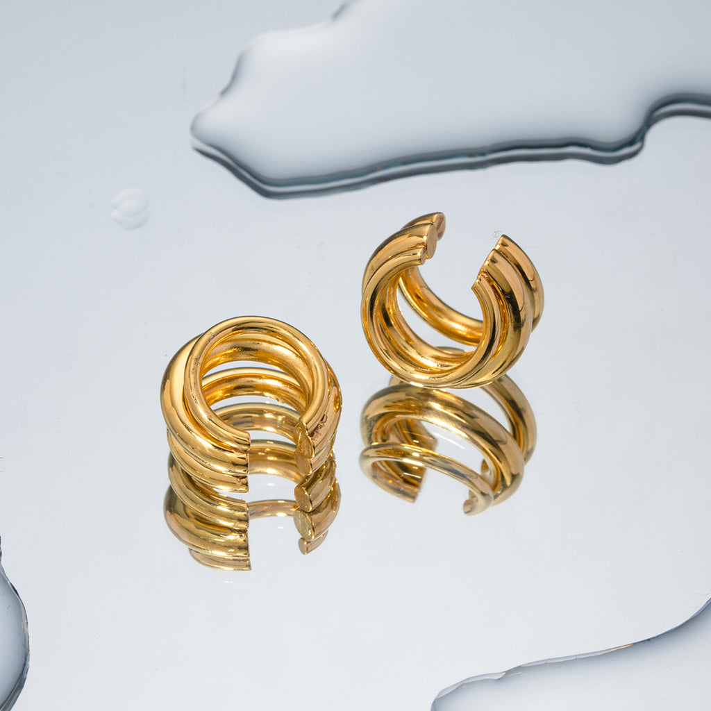 Damen Offene Creolen mit geschwungenem Design und elegantem Glanz Shop Nory