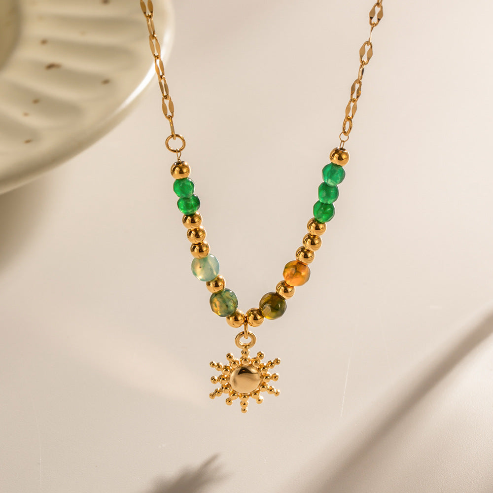 Damen Halskette mit farbigen Edelsteinen und goldener Sonnenanhänger Shop Nory