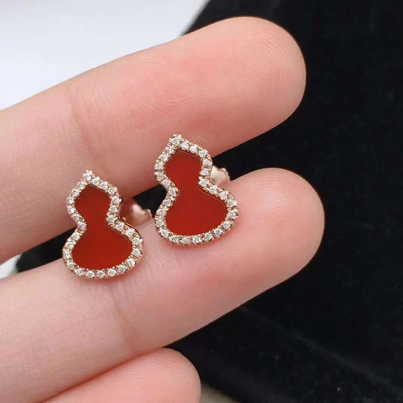Damen Ohrringe mit kunstvollem Design und funkelndem Zirkonia Shop Nory