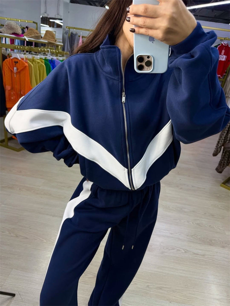 Damen eleganter sportlicher Zweiteiler Trainingsanzug mit Reißverschluss und kontrastierender V-Passe Shop Nory