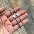 Damenarmband mit herzförmigen Anhängern und eleganter Gliederkette Shop Nory