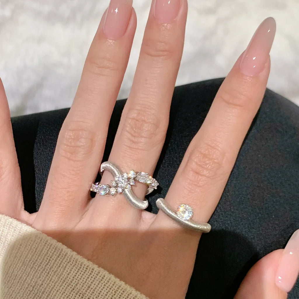 Damens Ring mit elegantem verlaufendem Design und funkelndem Zirkonia Shop Nory
