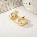Damen Ohrringe mit elegantem, geschwungenem Design Shop Nory