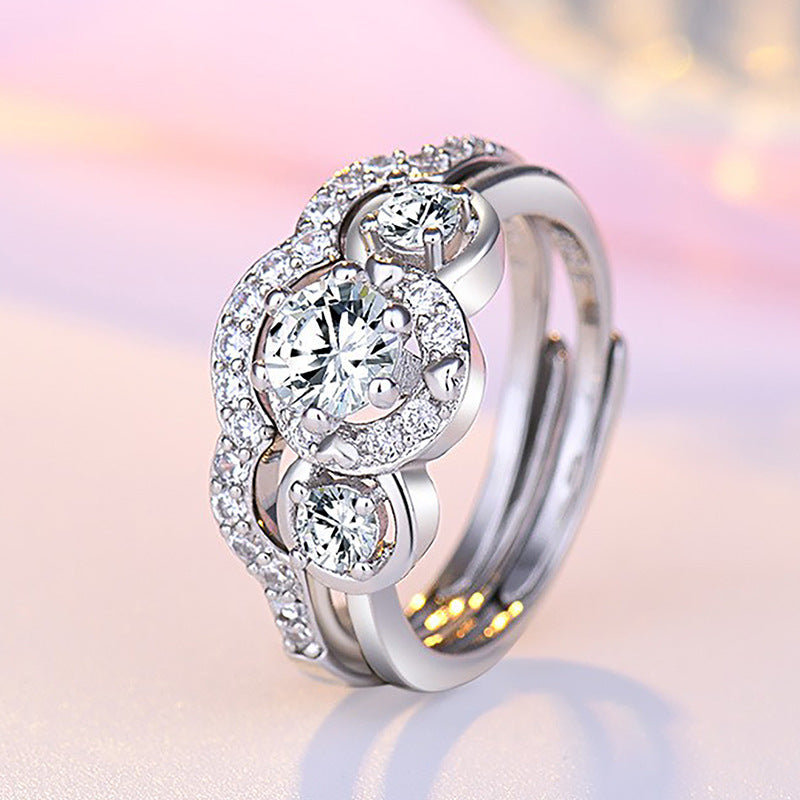 Damen Verlobungsring mit kunstvollem Zirkonia-Besatz und eleganter Wellenstruktur Shop Nory
