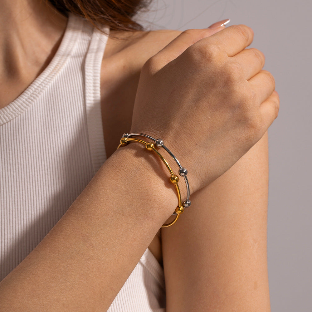 Damen Armreif mit elegantem Kugeldesign aus hypoallergenem Edelstahl Shop Nory