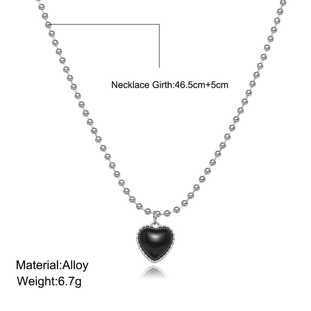 Damen Halskette mit herzförmigem Anhänger und funkelnden Details Shop Nory
