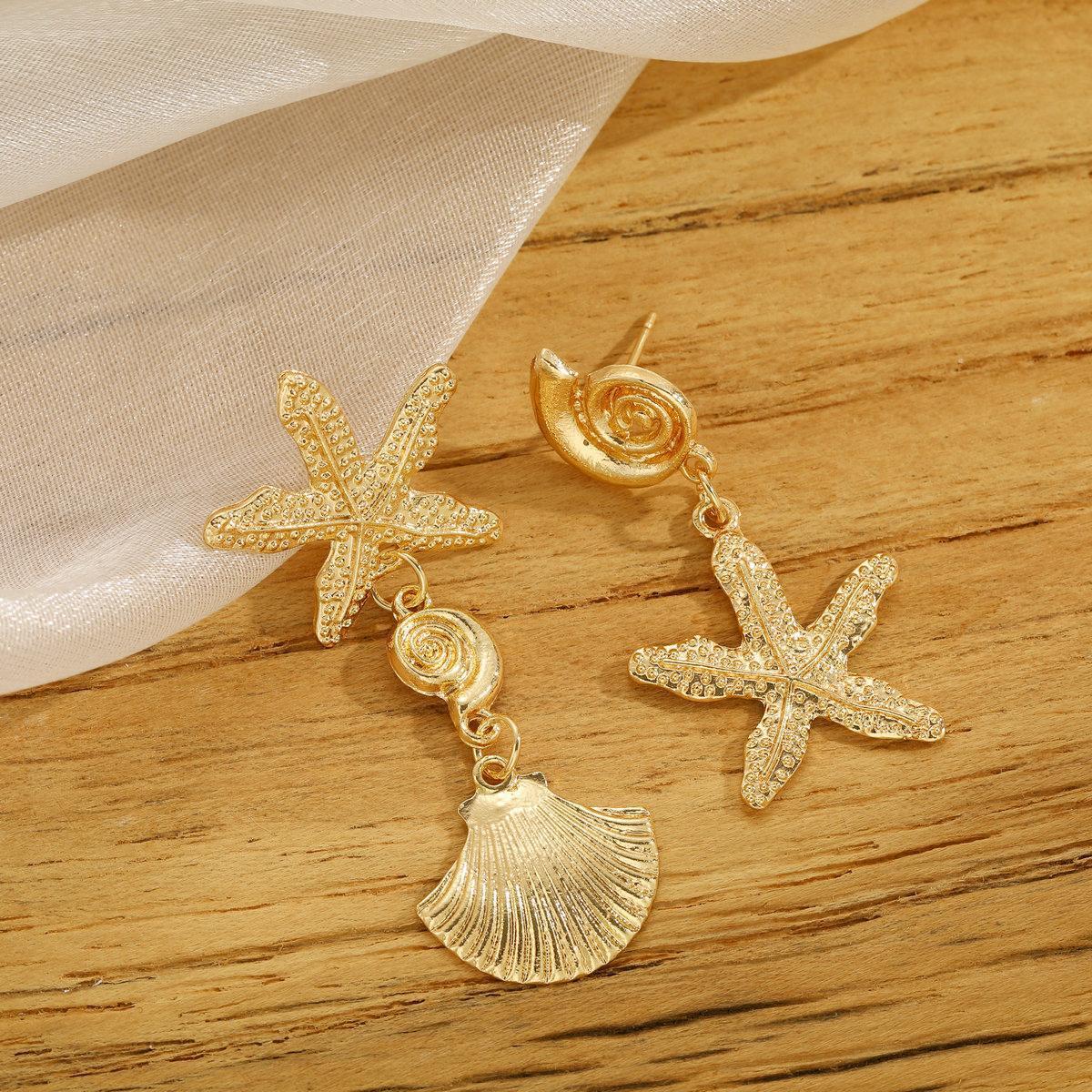 Damen Ohrringe mit maritimem Muschelmotiv und funkelnden Akzenten Shop Nory