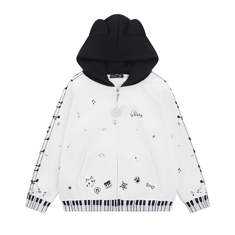 Damen Kapuzensweatjacke mit durchgehendem Reißverschluss, Musikprint, Klaviertasten‑Bündchen und Ohrenkapuze Shop Nory