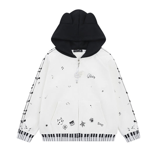 Damen Kapuzensweatjacke mit durchgehendem Reißverschluss, Musikprint, Klaviertasten‑Bündchen und Ohrenkapuze Shop Nory