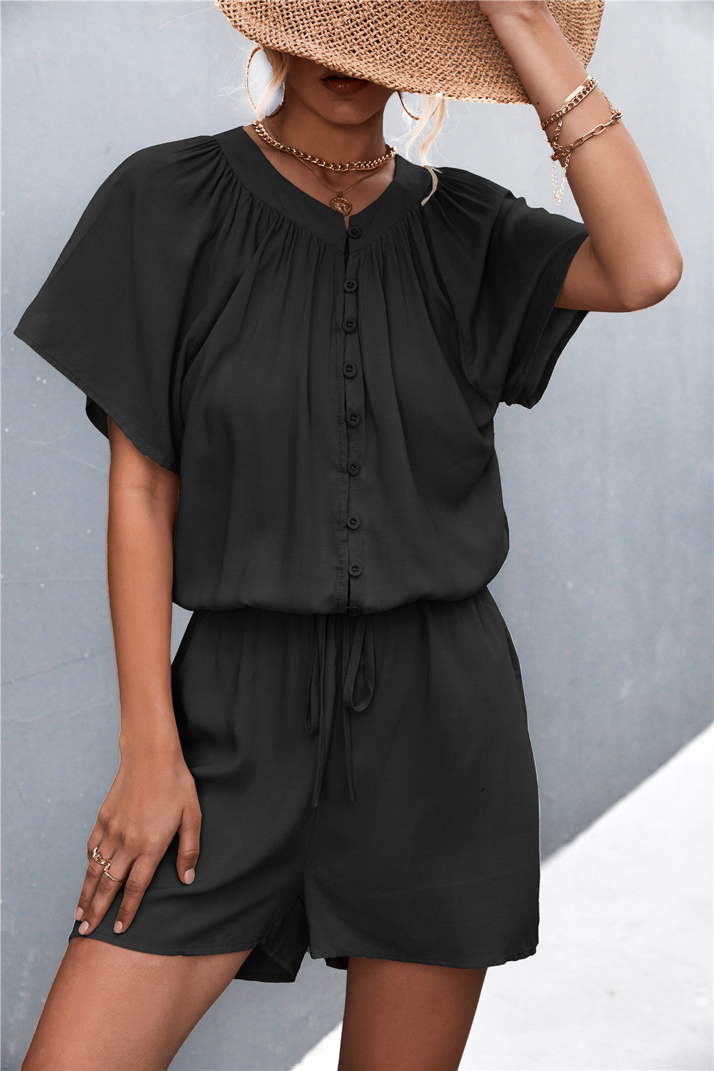 Damen Jumpsuit mit elastischem Bund und knopfverzierter Front