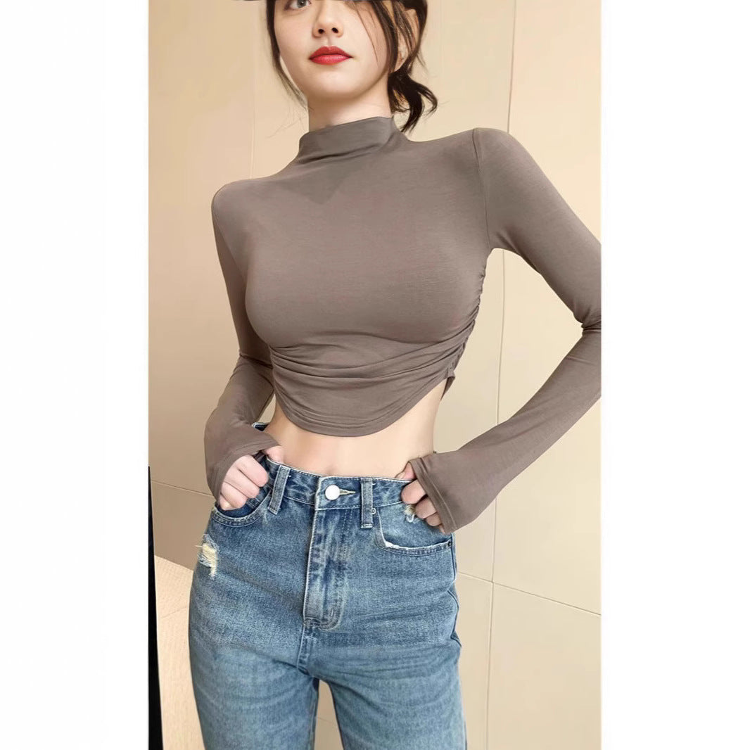 Damen Figurnahes Langarm-Cropped-Top mit Stehkragen, seitlicher Raffung und verlängerten Ärmeln Shop Nory
