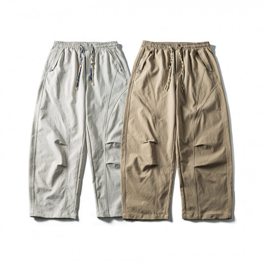 Unisex Weite Cropped-Hose mit Tunnelzug, elastischem Bund und markanten Nahtpaneelen Shop Nory