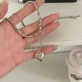 Damen Halskette mit herzförmigem Anhänger und modernem Gliederdesign Shop Nory