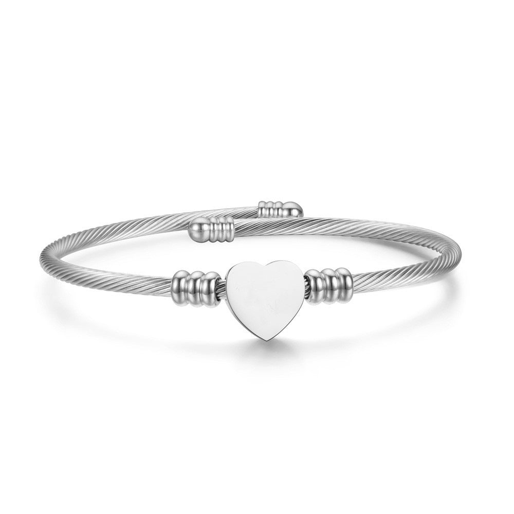 Damen Armreif mit stilvollem Herzanhänger aus hochwertigem Edelstahl Shop Nory