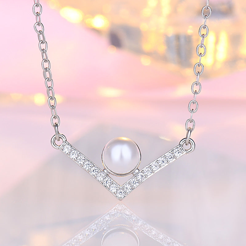 Damen Halskette aus hochwertigem Edelstahl mit eleganter Perle und funkelnden Zirkonia-Elementen Shop Nory