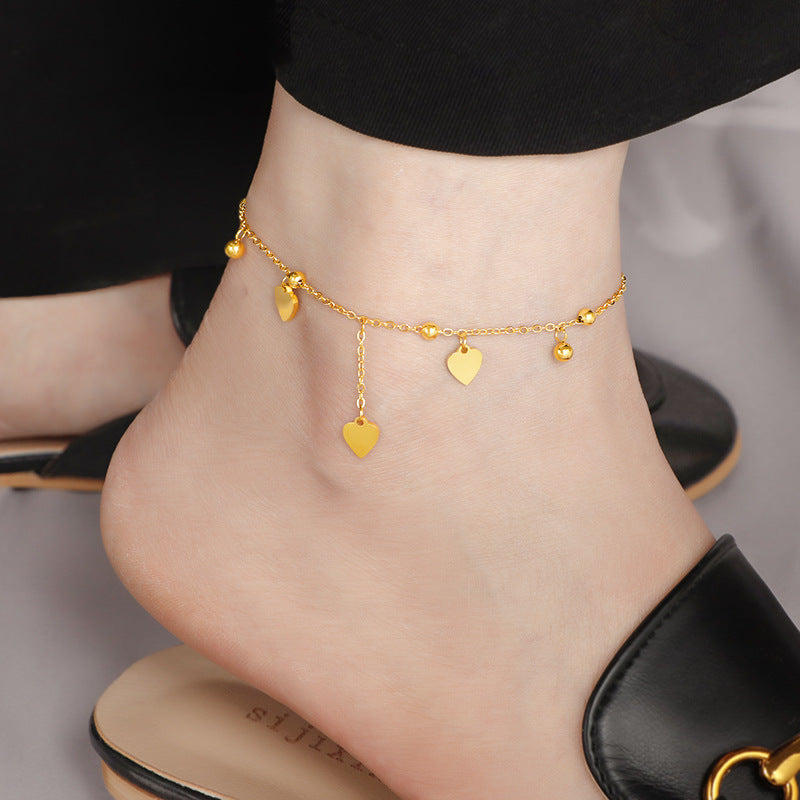 Damen zarte Fußkette mit herzförmigen Anhängern und glänzenden Kugeldetails Shop Nory