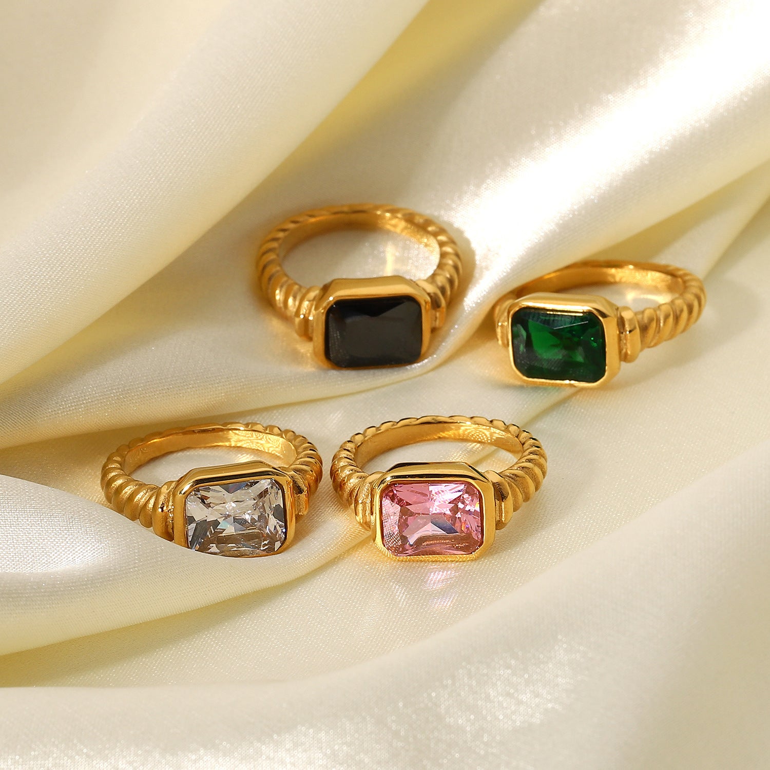 Damen eleganter Ring mit rosa Zirkonia und gedrehtem Edelstahl Shop Nory