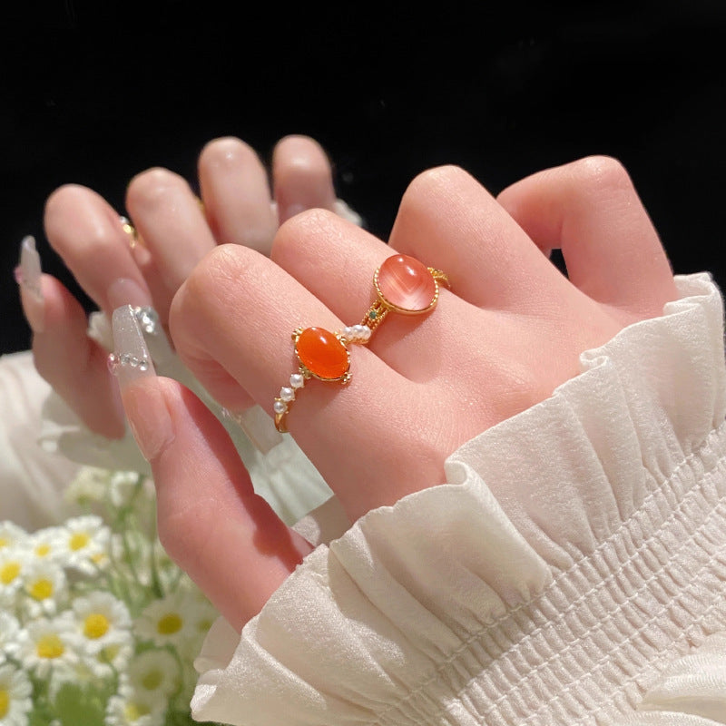 Damenring mit ovalem Rosenquarz und filigranem Golddesign Shop Nory