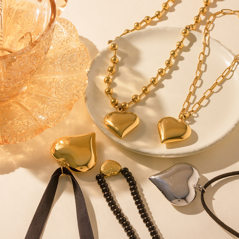 Damen Armband mit eleganten Perlen und herzförmigem Anhänger Shop Nory