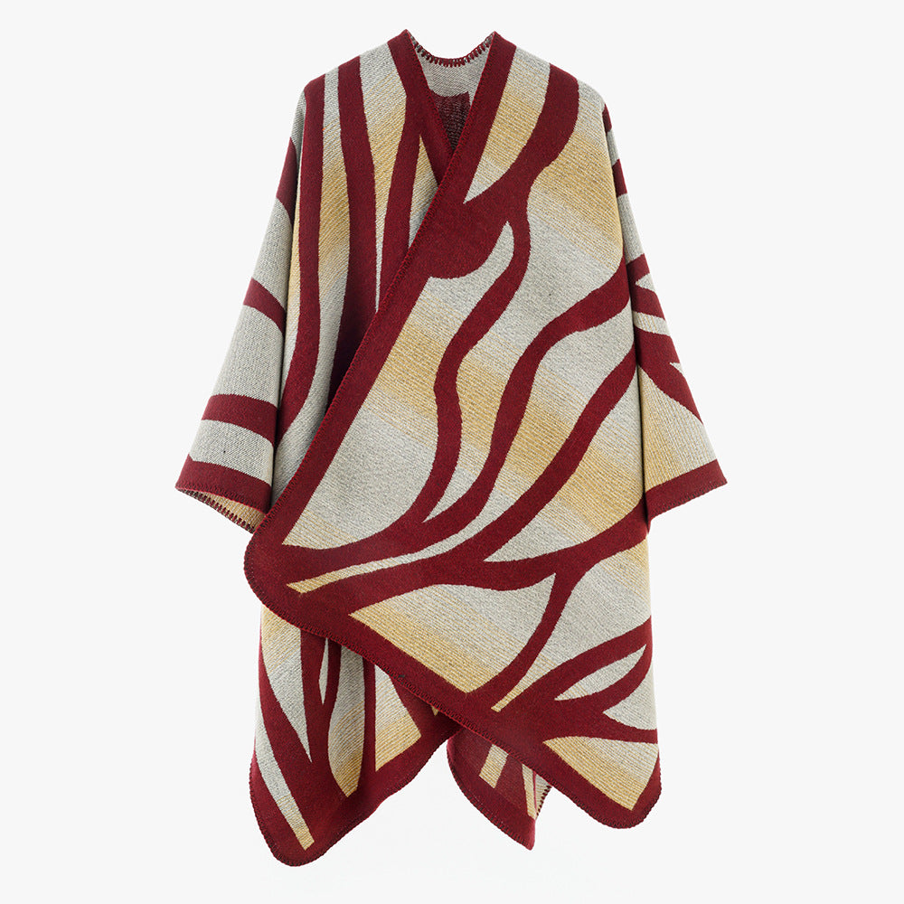 Damen Oversize-Strickcape mit abstrakter Wellenjacquard‑Struktur und kontrastierter Kettelkante Shop Nory