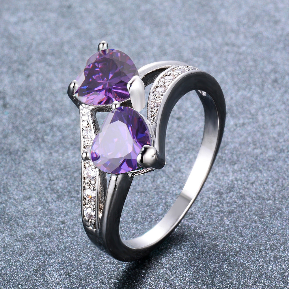 Damen Ring mit zwei herzförmigen blauen Zirkonen und funkelnden Zirkonia-Details Shop Nory