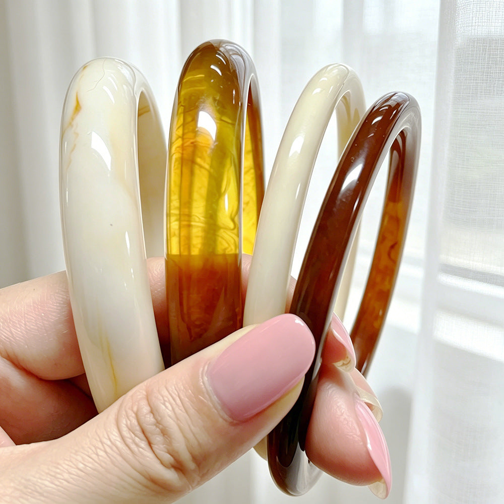 Damenarmreif mit geschwungenem Design und glänzender Oberfläche Shop Nory