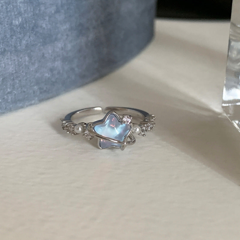 Damenring mit funkelndem Sternendesign und eleganten Perlenakzenten Shop Nory