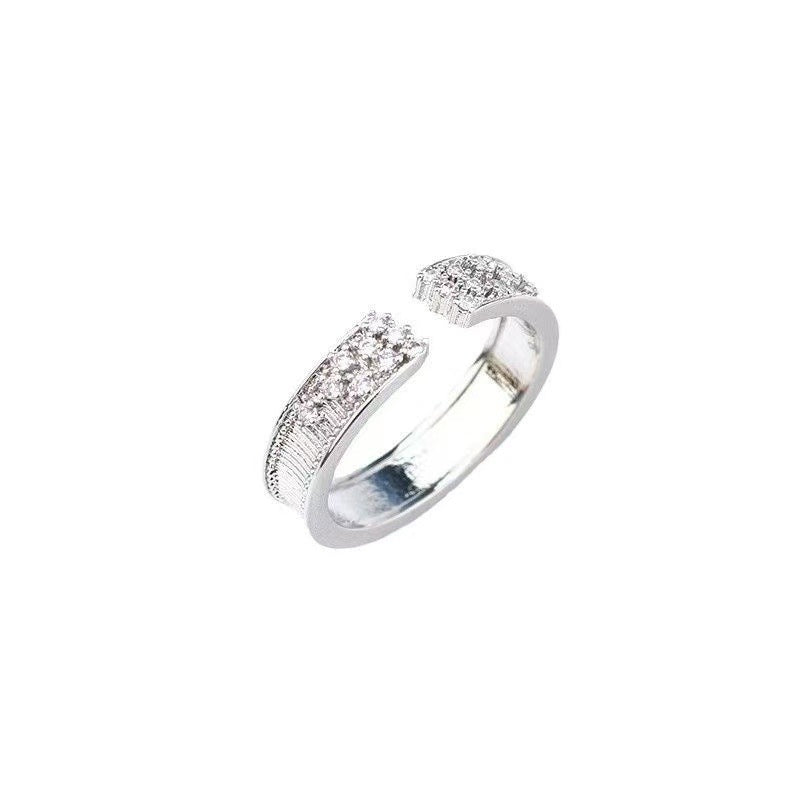 Damen Ring mit funkelnden Zirkonsteinen und elegantem, geschwungenem Design Shop Nory