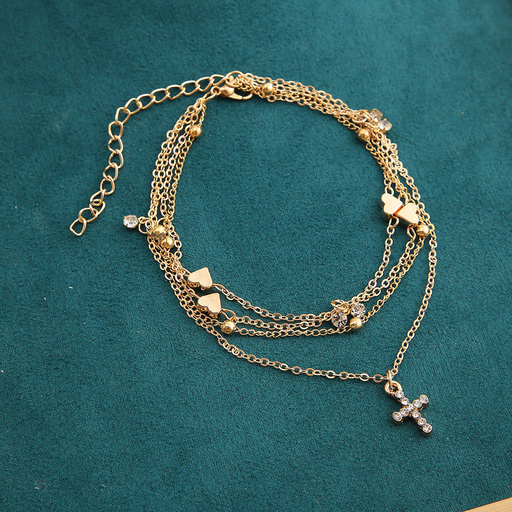 Damenarmband mit zierlichen Herz- und Perlenakzenten Shop Nory