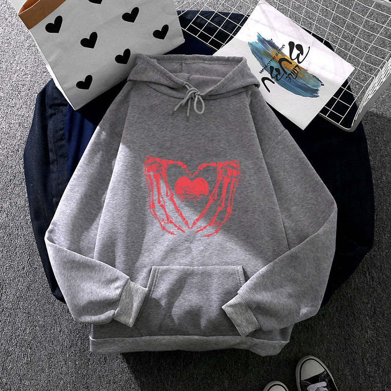 Damen nan stylischer Kapuzenpullover mit Skeletthand Herzmotiv und Kängurutasche Shop Nory