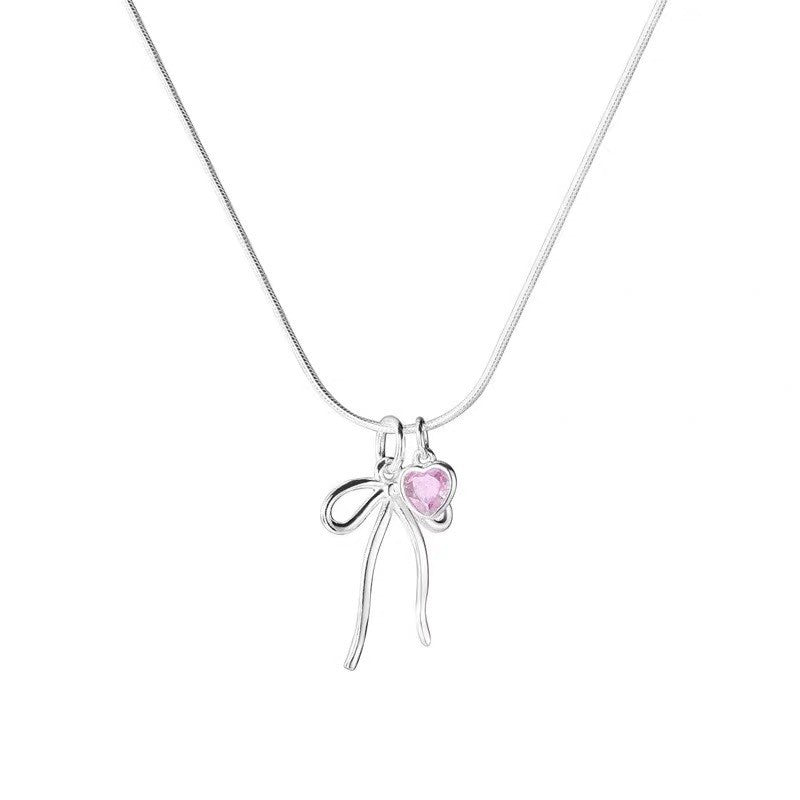 Damen Halskette mit elegantem Schleifenanhänger und herzförmigem Kristall Shop Nory