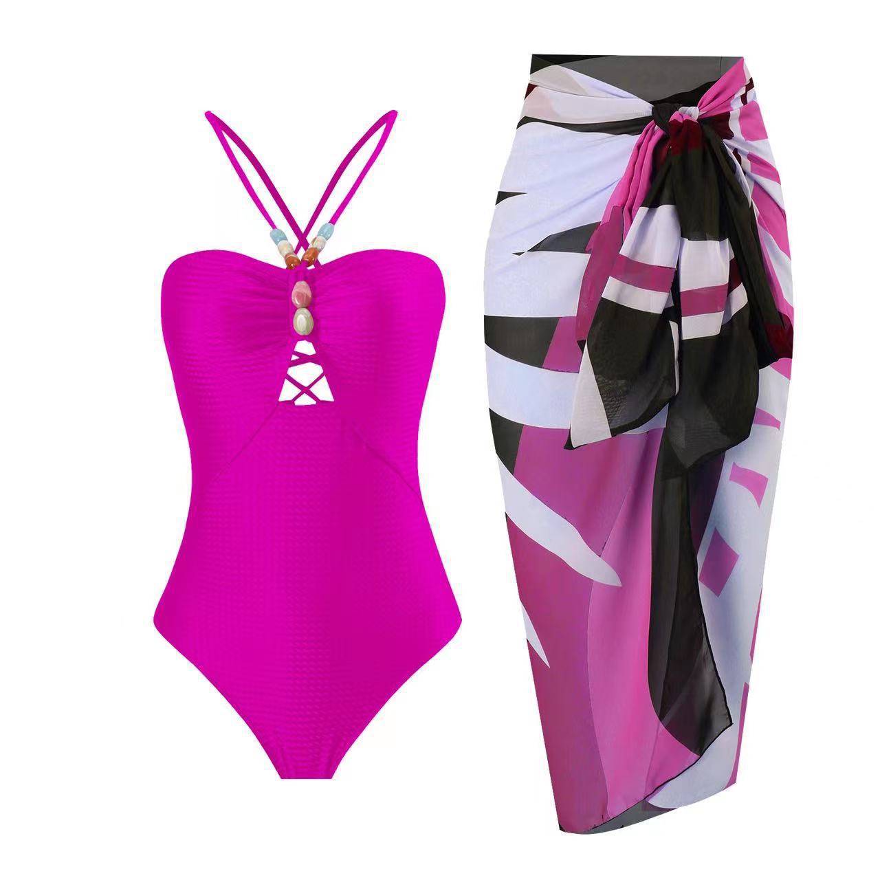 Damen Badeanzug mit elegantem Wickelrock und modischen Schmuckdetails
