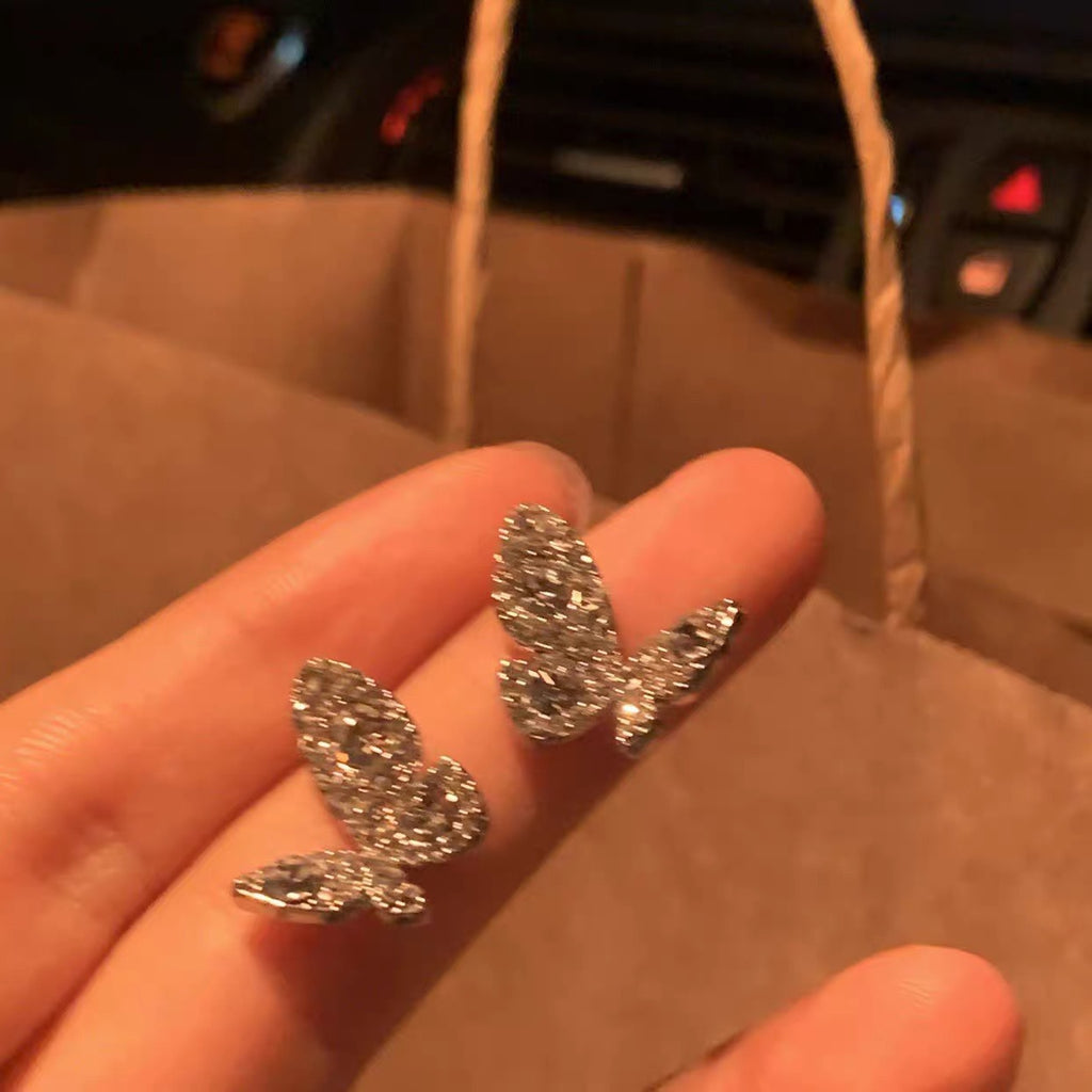 Damen Ohrstecker im Schmetterlingsdesign mit funkelnden Kristallen Shop Nory