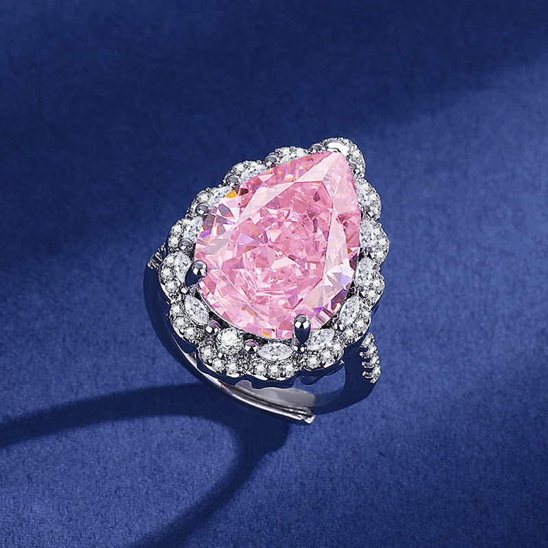 Damen eleganter und funkelnder Ring mit tropfenförmigem pinkem Stein Shop Nory