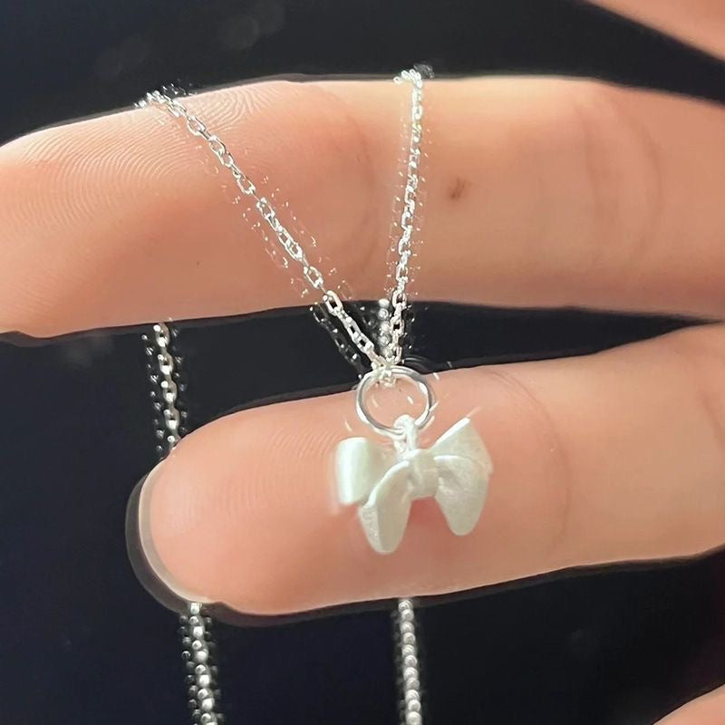 Damen Halskette mit filigranem Schleifenanhänger Shop Nory